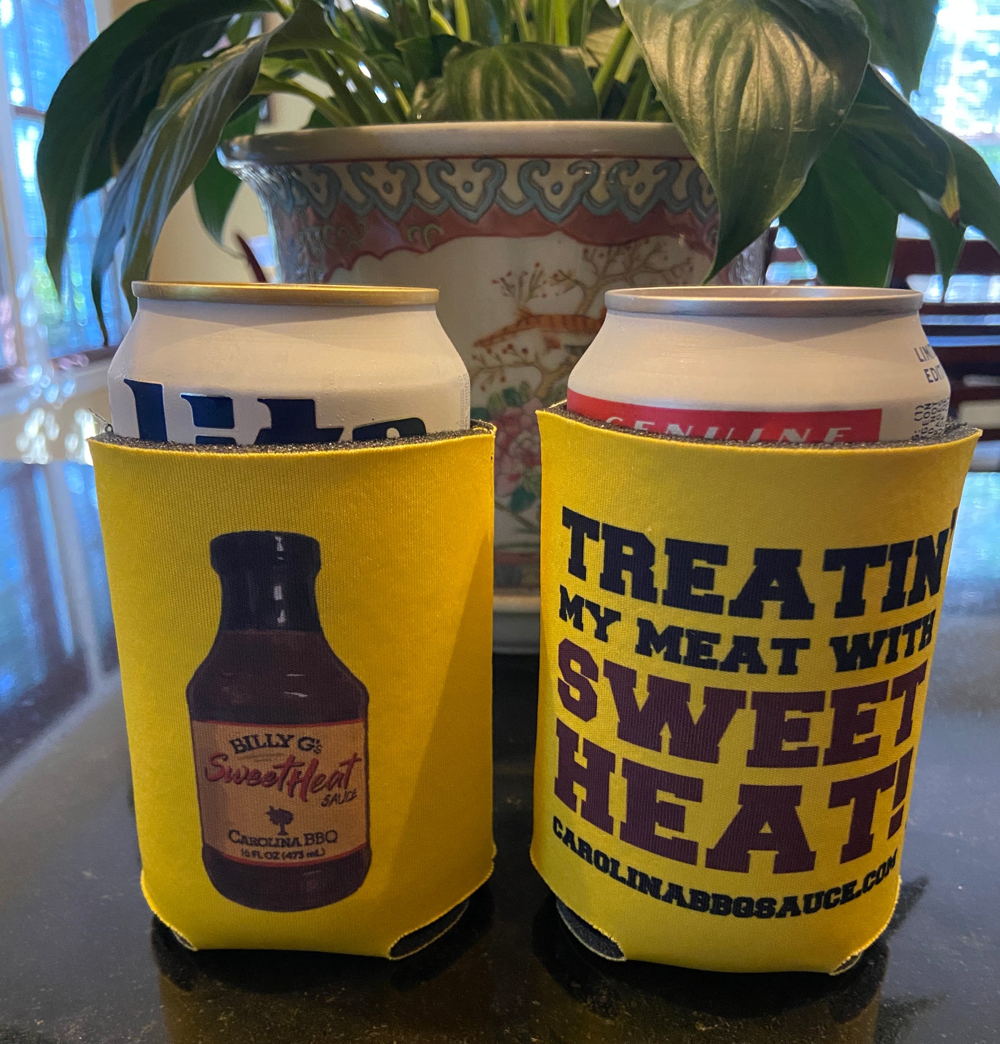 Billy G's Sweet Heat Koozie - in use with cans